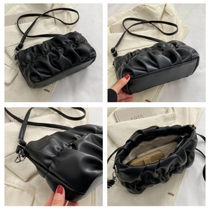 Internal view of black ruched shoulder bag showing spacious storage for daily essentials
