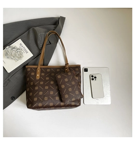 Detailed view of brown floral tote bag set with clover pattern and inner pouch