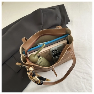 Detail of coffee tote bag interior showing large capacity for tablet and daily items