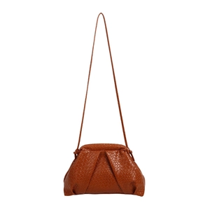Caramel woven texture dumpling shoulder bag with leather strap on white background