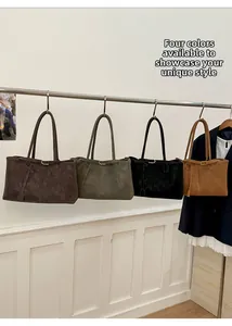 Detail view of four large capacity tote bags in dark brown, grey-green, black, and caramel