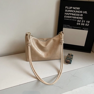 Minimalist beige tote bag in premium faux leather with vintage patterned shoulder strap