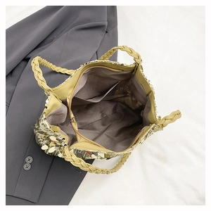 Top view of large golden sequin tote bag with woven handles and functional inner pockets