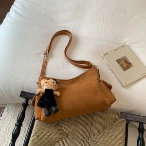 Retro brown suede shoulder bag with adjustable strap and cute teddy bear charm