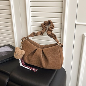Brown pleated underarm bag with leopard texture and cute plush bear charm accessory