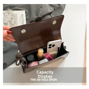 Detail view of the deep brown leather shoulder bag interior showing its large storage capacity