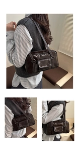 Detail of dark brown glossy PU shoulder bag with white contrast stitching and pocket