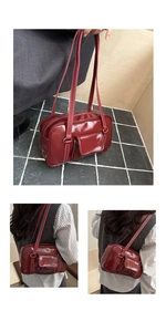 Detail of burgundy patent leather shoulder bag with white contrast stitching and dual straps