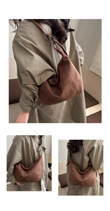 Close-up of suede shoulder bag with hobo silhouette and knot detail on the strap