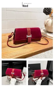 Detailed view of dark red shoulder bag with suede拼接 and silver H-shaped clasp