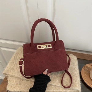 Vintage burgundy suede handbag for women featuring gold buckle and detachable shoulder strap