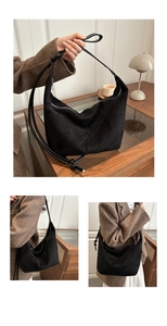 Close-up of black suede hobo bag showing soft texture and large capacity design