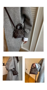 Detail of vintage shell bag showing leather handles and brown monogram canvas texture