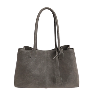 Minimalist dark gray tote bag with long shoulder straps and subtle matte texture
