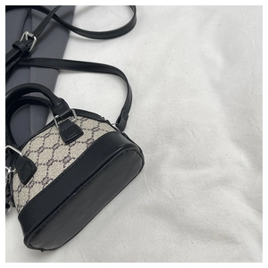 Top view of classic monogram canvas Boston bag with black leather trim and silver hardware