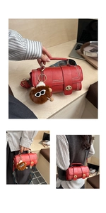 Detail of red cylindrical leather bag featuring decorative rivets and a gold twist lock