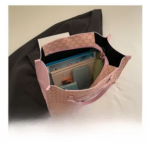Top view of pink monogram tote bag showing large capacity for laptop and daily essentials