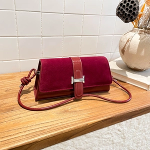 Vintage burgundy crossbody baguette bag with silver H-buckle and knotted strap detail