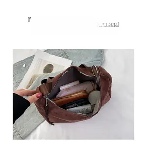 Brown suede tote bag interior showing large capacity for wallet, umbrella and cosmetics
