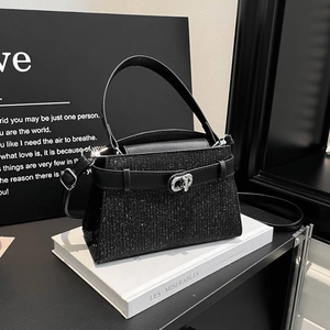 Elegant black glitter handbag with silver clasp and top handle for women's fashion