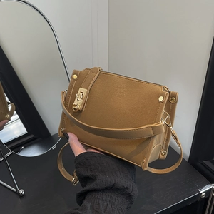 Brown vintage suede shoulder bag with gold twist lock and adjustable strap