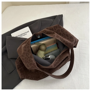 Interior view of large leopard print tote bag showing spacious storage for daily items