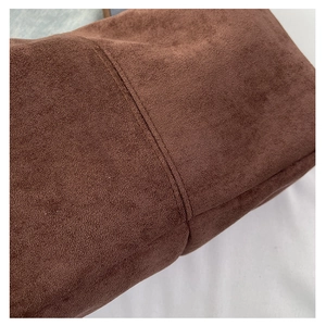 Detail shot of vintage dark brown suede tote featuring premium double stitching