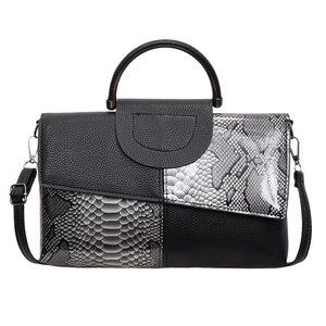 Snake and pebble grain leather handbag with rigid metal handle and shoulder strap