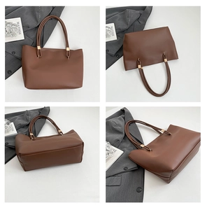 Macro detail of dark brown tote bag with slim dual handles and golden metal hardware