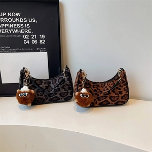 Vintage leopard print plush underarm bag with gold chain and trendy sunglasses pompom