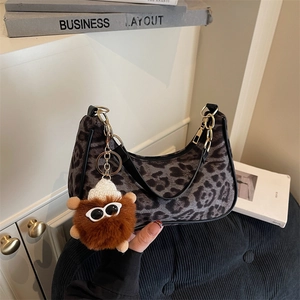 Chic leopard print plush underarm bag with cute monster charm for women winter fashion