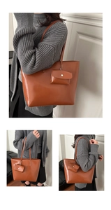 Close-up of caramel brown tote bag set with matching small pouch and long shoulder straps