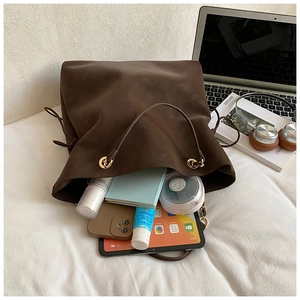 Top view of chocolate suede tote bag showing large capacity for laptop and cosmetics
