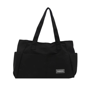 Grande borsa shopping nera in tela da donna con tessuto resistente e etichetta moda