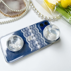 Detail of blue iPhone case with lace, pearls, and dual 3D cloud-shaped airbag phone grips