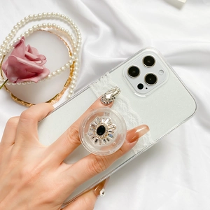 Close-up of glitter iPhone case with vintage rhinestone airbag phone ring holder
