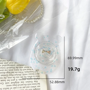 Detail showing bear phone grip dimensions 69.99mm with blue glitter and silver bow