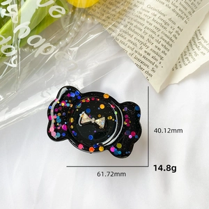 Close-up of glitter rhinestone bow phone grip with dimensions 40.12mm by 61.72mm