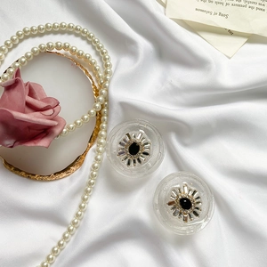 Macro shot of luxury sunflower phone grip with black gemstone and sparkling crystals