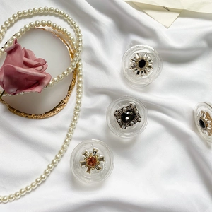 Luxury rhinestone pearl phone grip sockets featuring vintage gems on white silk