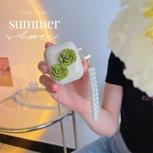 Close-up of AirPods case with 3D green roses and elegant faux pearl handle chain