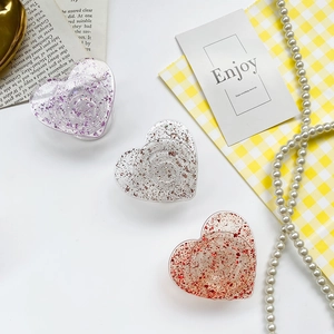 Sparkly heart shaped phone grip sockets with colorful sequins in three elegant colors
