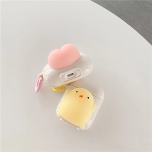 Detail showing soft silicone AirPods cases with cute 3D chick and peach charms