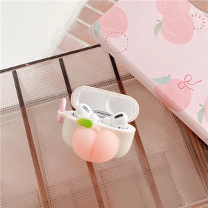 Detail of 3D peach AirPods Pro case with frosted texture on a stylish brown grid tray