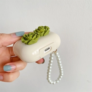 Creamy white wireless earphone case with 3D green rose relief and pearl wrist strap