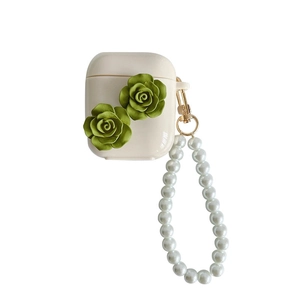 Cream AirPods case with olive green 3D camellia flowers and elegant pearl wrist strap