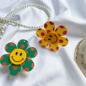 Detailed view of colorful sunflower phone sockets with smiley face and polka dot patterns