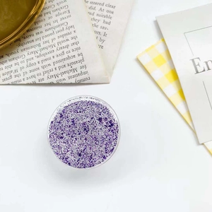 Expandable phone socket grip featuring purple glitter flakes and gold foil in a resin finish