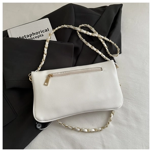 Detailed back view of white lychee texture shoulder bag with golden zipper and chain strap