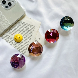 Macro detail of gem-style collapsible phone sockets in vibrant multi-color crystals